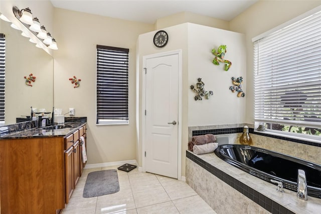 14494 Copeland Way, Brooksville, FL 34604 - full bath featuring vanity, a garden tub, tile patterned flooring, and baseboards