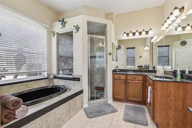 14494 Copeland Way, Brooksville, FL 34604 - full bath with vanity, a garden tub, a stall shower, and tile patterned flooring
