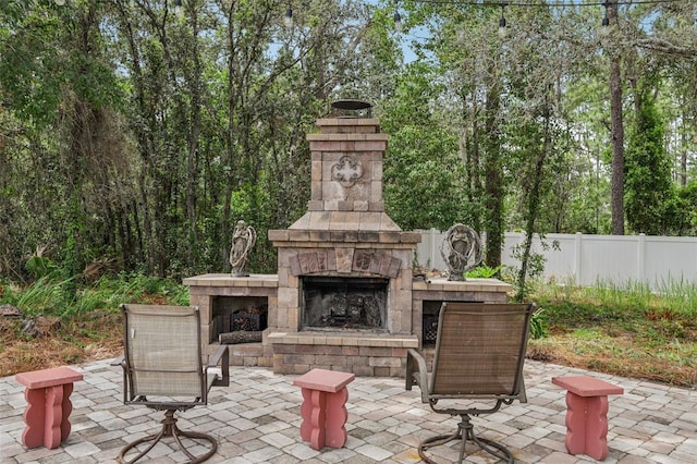 14494 Copeland Way, Brooksville, FL 34604 - view of patio / terrace featuring an outdoor stone fireplace