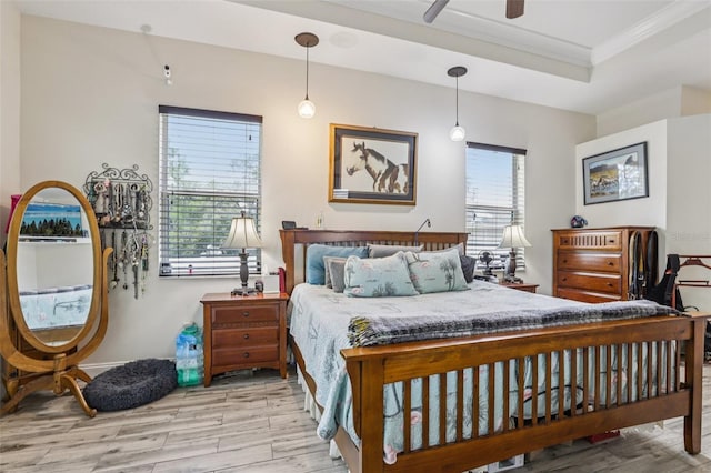 14494 Copeland Way, Brooksville, FL 34604 - bedroom with wood finished floors, ornamental molding, ceiling fan, and a raised ceiling