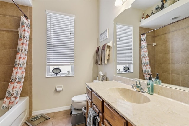 14494 Copeland Way, Brooksville, FL 34604 - full bath featuring vanity, toilet, tile patterned floors, shower / tub combo, and baseboards