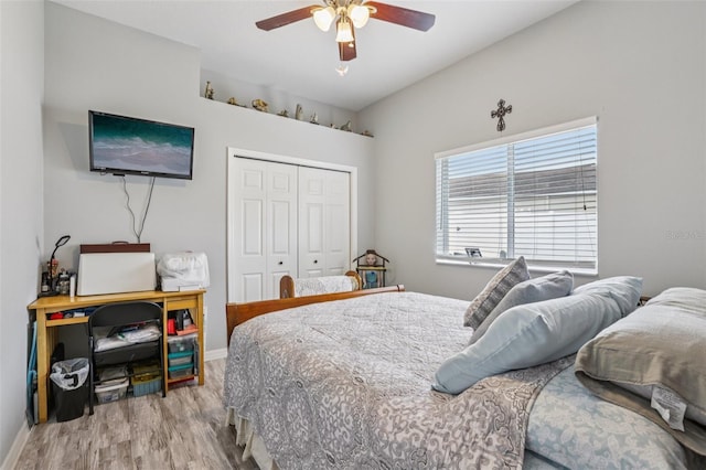 14494 Copeland Way, Brooksville, FL 34604 - bedroom featuring wood finished floors, a closet, baseboards, and a ceiling fan