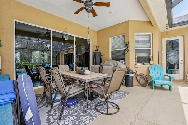 14494 Copeland Way, Brooksville, FL 34604 - view of patio / terrace with a ceiling fan, outdoor dining space, and glass enclosure
