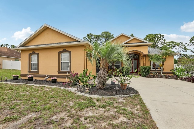 14494 Copeland Way, Brooksville, FL 34604 - view of front of house featuring stucco siding and concrete driveway