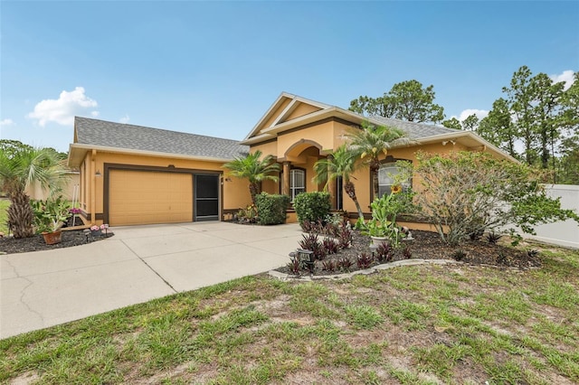 14494 Copeland Way, Brooksville, FL 34604 - view of front of home with stucco siding, driveway, and an attached garage
