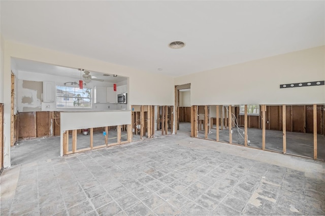 260 42nd Ave, St Pete Beach, FL 33706 - unfurnished living room with plenty of natural light