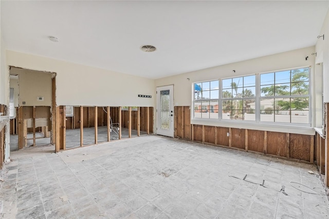 260 42nd Ave, St Pete Beach, FL 33706 - spare room with a wainscoted wall, wooden walls, and a smoke detector