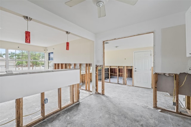 260 42nd Ave, St Pete Beach, FL 33706 - empty room with concrete floors and a ceiling fan