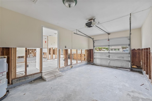 260 42nd Ave, St Pete Beach, FL 33706 - garage with a garage door opener and water heater