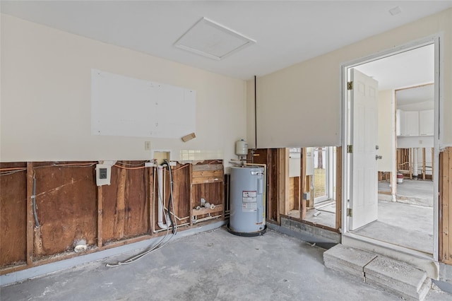 260 42nd Ave, St Pete Beach, FL 33706 - unfurnished room featuring electric water heater and unfinished concrete floors