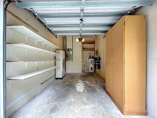 27511 Hialeah Way, Wesley Chapel, FL 33544 - garage featuring a garage door opener, water heater, and freestanding refrigerator