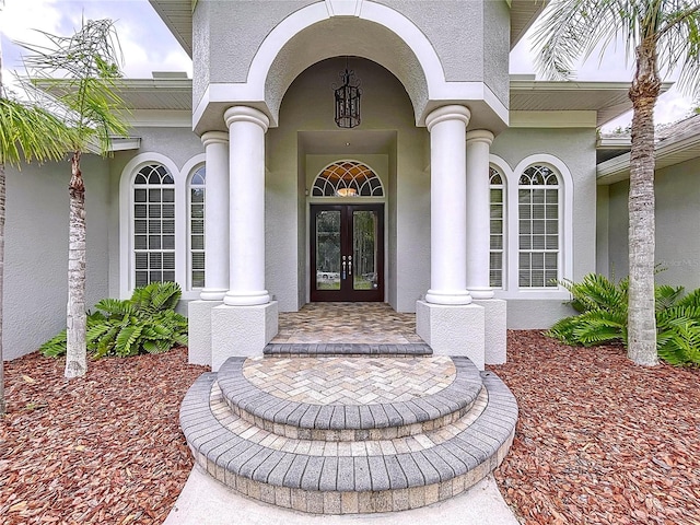 27511 Hialeah Way, Wesley Chapel, FL 33544 - entrance to property with french doors and stucco siding