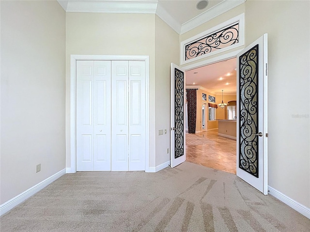 27511 Hialeah Way, Wesley Chapel, FL 33544 - unfurnished bedroom featuring baseboards, crown molding, carpet, a towering ceiling, and a closet
