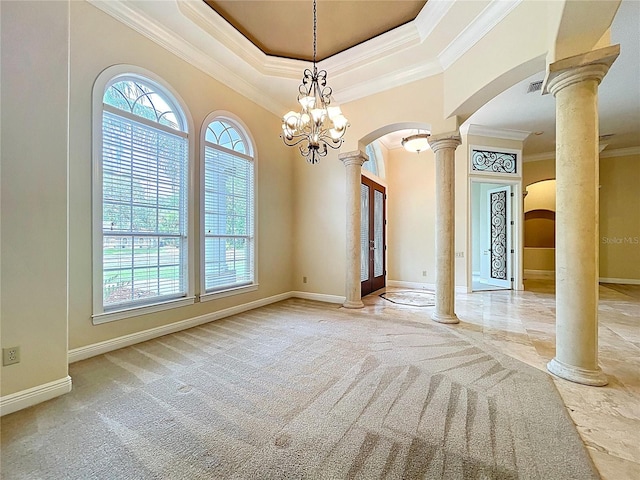 27511 Hialeah Way, Wesley Chapel, FL 33544 - carpeted empty room with arched walkways, decorative columns, crown molding, baseboards, and a tray ceiling
