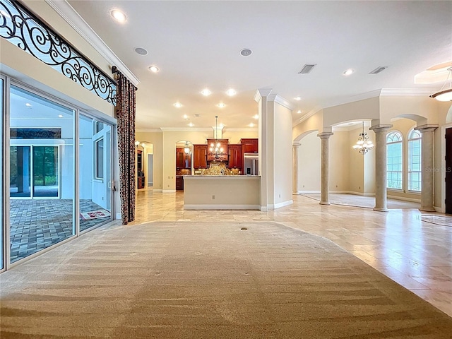 27511 Hialeah Way, Wesley Chapel, FL 33544 - corridor featuring ornate columns, ornamental molding, arched walkways, baseboards, and a chandelier