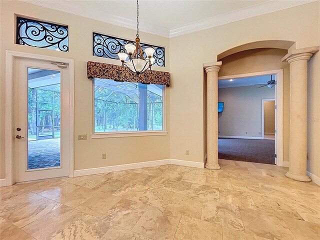 27511 Hialeah Way, Wesley Chapel, FL 33544 - unfurnished dining area with decorative columns, a chandelier, arched walkways, stone tile flooring, and crown molding