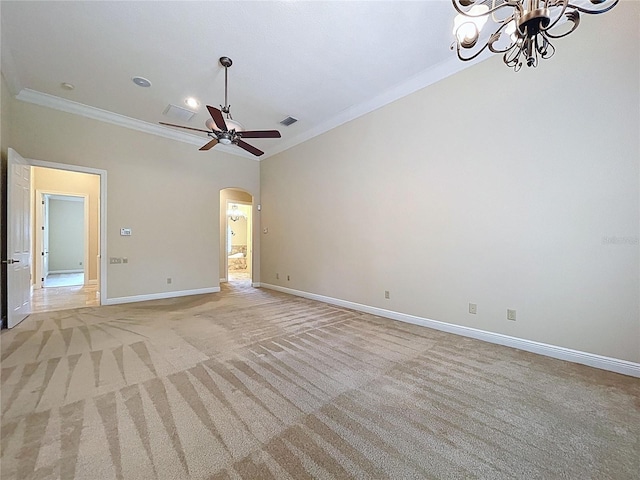 27511 Hialeah Way, Wesley Chapel, FL 33544 - unfurnished room with arched walkways, ornamental molding, a chandelier, light colored carpet, and baseboards