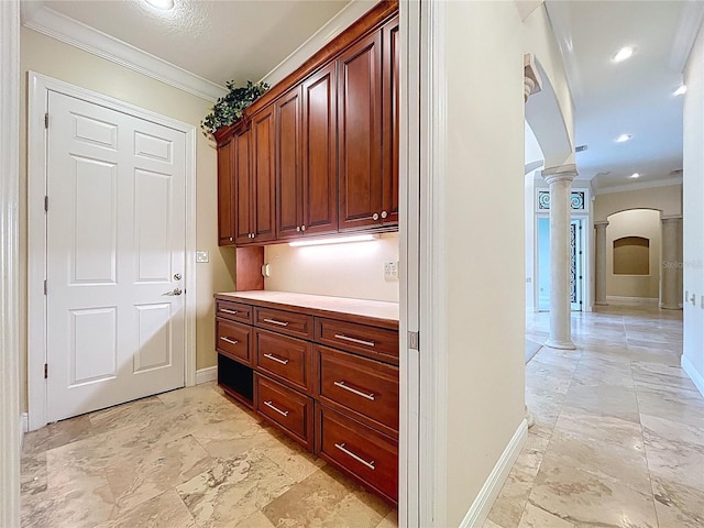 27511 Hialeah Way, Wesley Chapel, FL 33544 - hall with ornate columns, arched walkways, crown molding, baseboards, and recessed lighting
