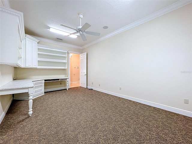 27511 Hialeah Way, Wesley Chapel, FL 33544 - unfurnished office with built in study area, crown molding, a ceiling fan, dark carpet, and baseboards
