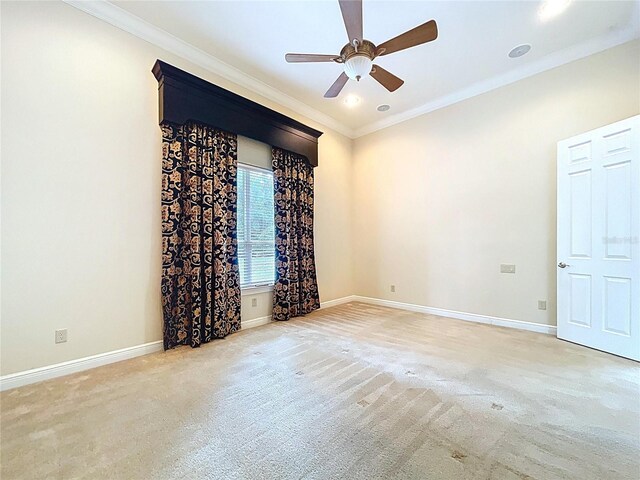 27511 Hialeah Way, Wesley Chapel, FL 33544 - unfurnished room with crown molding, carpet floors, ceiling fan, and baseboards