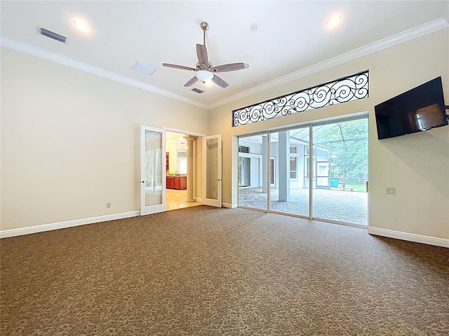 27511 Hialeah Way, Wesley Chapel, FL 33544 - spare room with baseboards, crown molding, dark carpet, and ceiling fan