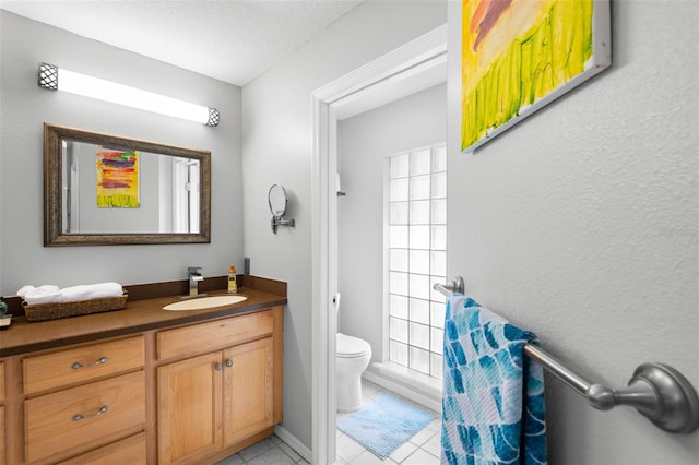 6143 Black Walnut Dr, Bartow, FL 33830 - bathroom with toilet, tile patterned flooring, vanity, and a textured ceiling