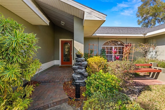6143 Black Walnut Dr, Bartow, FL 33830 - doorway to property with stucco siding and a shingled roof