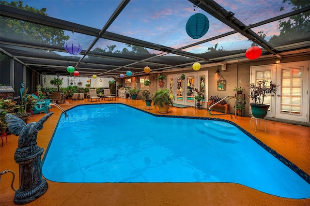 1151 Lancer Ln, Tarpon Springs, FL 34689 - outdoor pool with french doors, a patio area, and a lanai