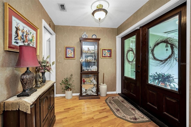 1151 Lancer Ln, Tarpon Springs, FL 34689 - entrance foyer with light wood-type flooring and baseboards
