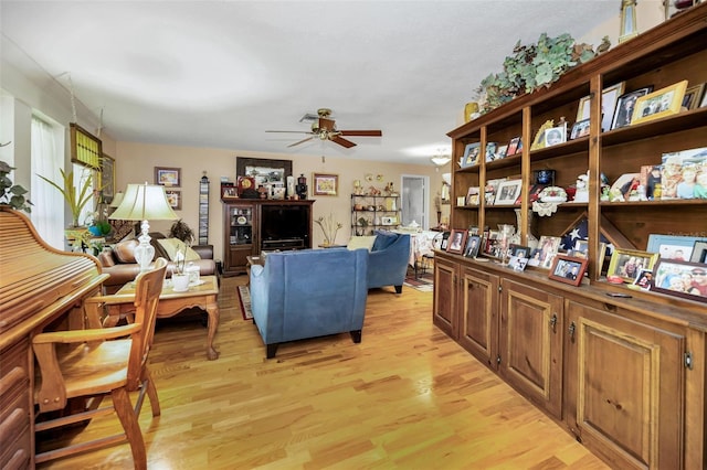 1151 Lancer Ln, Tarpon Springs, FL 34689 - living room featuring light wood-style floors and a ceiling fan