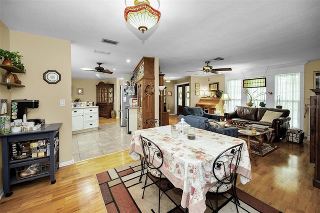 1151 Lancer Ln, Tarpon Springs, FL 34689 - dining area with a ceiling fan and light wood-style flooring