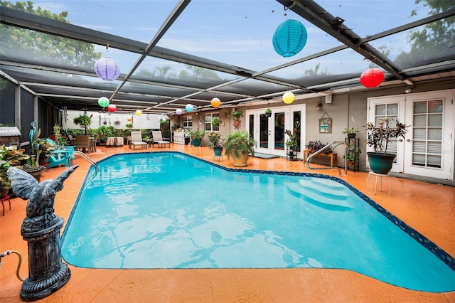 1151 Lancer Ln, Tarpon Springs, FL 34689 - swimming pool featuring french doors, a patio, and a lanai