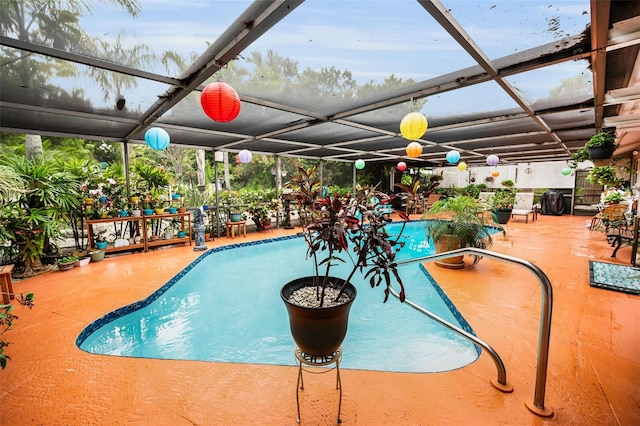 1151 Lancer Ln, Tarpon Springs, FL 34689 - view of pool featuring a patio and glass enclosure