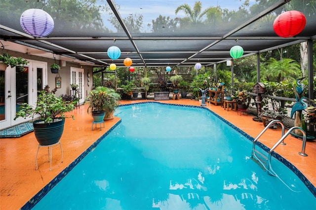 1151 Lancer Ln, Tarpon Springs, FL 34689 - outdoor pool featuring french doors, a patio, and glass enclosure