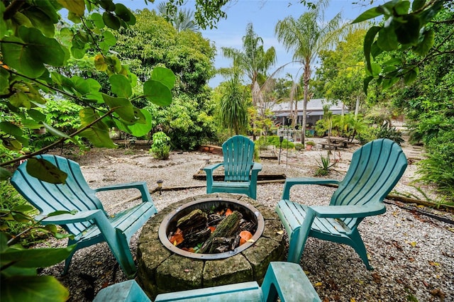 1151 Lancer Ln, Tarpon Springs, FL 34689 - view of patio with a fire pit