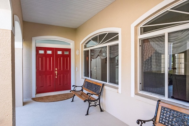 3452 Forelock Rd, Tarpon Springs, FL 34688 - view of exterior entry featuring stucco siding