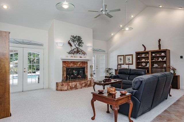 3452 Forelock Rd, Tarpon Springs, FL 34688 - carpeted living area featuring french doors, recessed lighting, a ceiling fan, high vaulted ceiling, and a premium fireplace