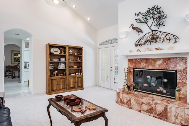3452 Forelock Rd, Tarpon Springs, FL 34688 - living room with arched walkways, a fireplace, carpet flooring, high vaulted ceiling, and recessed lighting