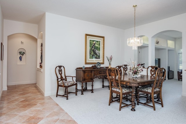 3452 Forelock Rd, Tarpon Springs, FL 34688 - dining space with arched walkways and a chandelier