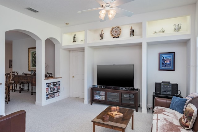3452 Forelock Rd, Tarpon Springs, FL 34688 - carpeted living area featuring arched walkways and ceiling fan