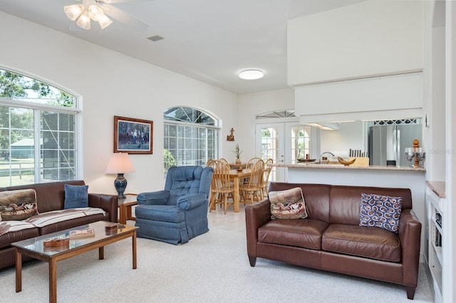 3452 Forelock Rd, Tarpon Springs, FL 34688 - carpeted living room with french doors and ceiling fan