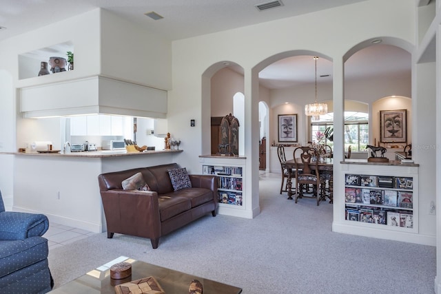3452 Forelock Rd, Tarpon Springs, FL 34688 - carpeted living area featuring arched walkways and a chandelier
