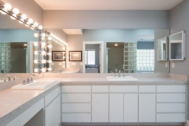 3452 Forelock Rd, Tarpon Springs, FL 34688 - bathroom featuring a stall shower and double vanity