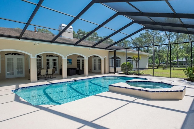 3452 Forelock Rd, Tarpon Springs, FL 34688 - view of pool featuring french doors, a patio, glass enclosure, and an outdoor living space