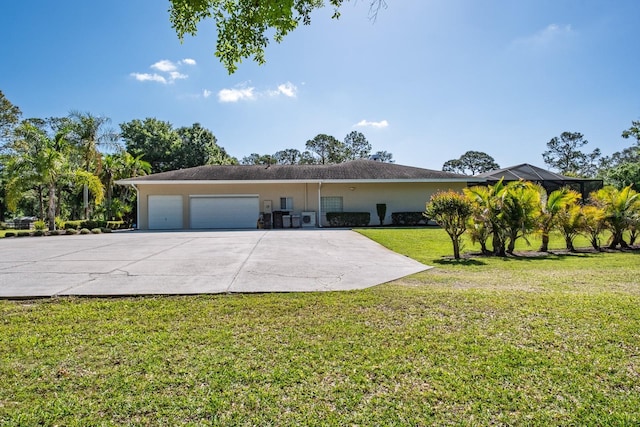 3452 Forelock Rd, Tarpon Springs, FL 34688 - view of front facade with a garage, stucco siding, concrete driveway, and a front yard