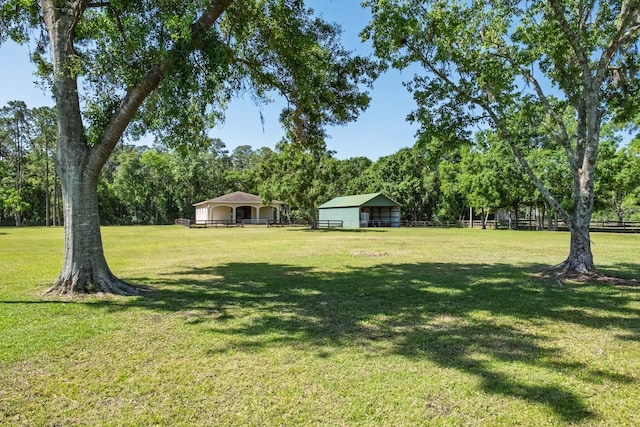 3452 Forelock Rd, Tarpon Springs, FL 34688 - view of yard featuring an outbuilding and view of scattered trees