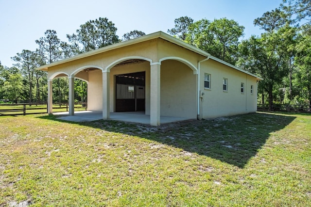 3452 Forelock Rd, Tarpon Springs, FL 34688 - view of property exterior featuring a patio and stucco siding