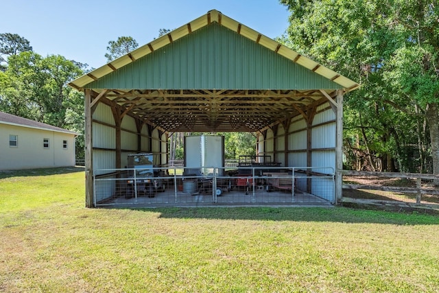 3452 Forelock Rd, Tarpon Springs, FL 34688 - rear view of house featuring an exterior structure, a carport, and an outbuilding