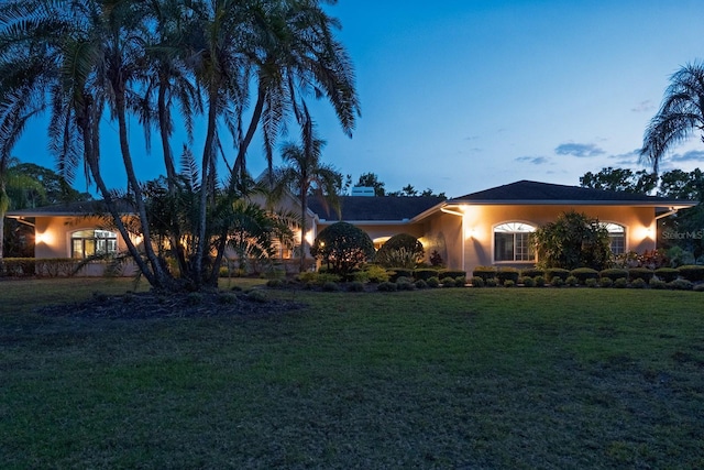 3452 Forelock Rd, Tarpon Springs, FL 34688 - view of front of house featuring stucco siding and a front yard