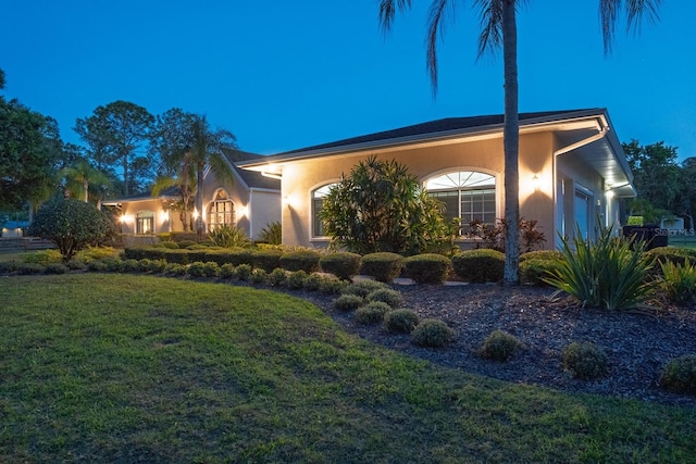 3452 Forelock Rd, Tarpon Springs, FL 34688 - view of front of home with a front lawn and stucco siding
